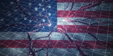 Digital network overlaying an American flag, representing US critical infrastructure under cyber threat.