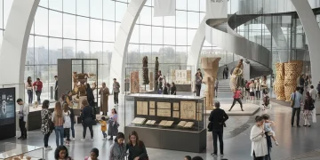 Visitors interacting with exhibits in a vibrant cultural institution, representing American heritage preservation.
